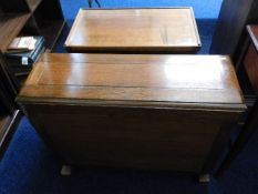 An oak drop leaf dining table