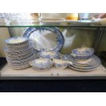 A quantity of antique blue & white dinner ware