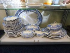 A quantity of antique blue & white dinner ware
