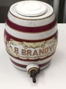 A vintage ceramic brandy barrel with brass tap