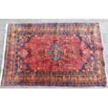 An early 20thC. Persian style rug 63in x 39.5in