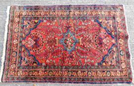 An early 20thC. Persian style rug 63in x 39.5in