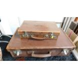 Two vintage suitcases twinned with a small blue shoe case