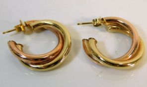 A pair of two tone 9ct gold earrings 2.9g