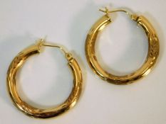 A pair of 9ct gold hoop earrings 2.1g