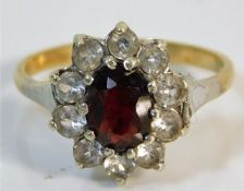 A 9ct gold ring set with red & white stones size N