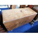 An antique drop leaf mahogany table