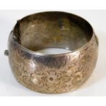 A silver bangle with chased decor 52.8g