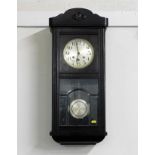 A 1920's oak cased wall clock 30in high