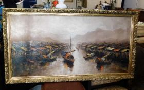 A framed Chinese oil painting of waterway scene