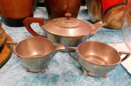 An art deco hammered pewter tea set