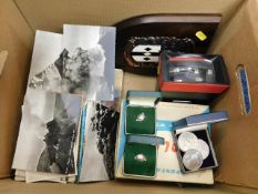 A box of sundry items including postcards which de