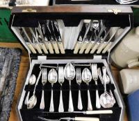 A cutlery set twinned with two other sets of plate