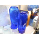 A pair of cobalt blue glass vases