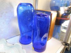 A pair of cobalt blue glass vases