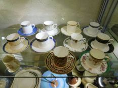 A quantity of decorative coffee cans & saucers inc