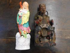 A Chinese porcelain figure twinned with a Chinese