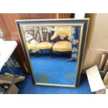 A large decorative mirror 40.5in x 28.5in