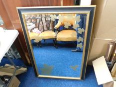 A large decorative mirror 40.5in x 28.5in