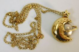 A 9ct gold chain 1.3g with a 14ct two tone gold pe