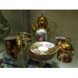 A gilded porcelain German coffee set