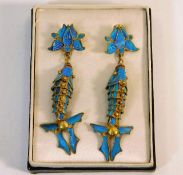 A pair of gilt reticulated fish earrings with king