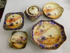 Five pieces of Noritake gilded desert scene porcel