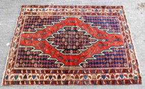 An early 20thC. Persian style rug 77in x 54in