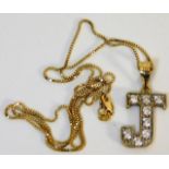 A 9ct gold chain with letter J pendant