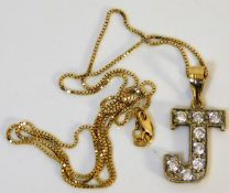 A 9ct gold chain with letter J pendant