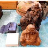 A carved wooden Buddha, one other Buddha & a small