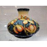 A modern Moorcroft pottery vase with floral decor