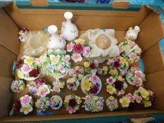 A boxed quantity of mostly floral porcelain orname