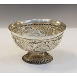 Embossed white metal pedestal bowl decorated with birds amongst foliage, 3.7toz approx Condition: