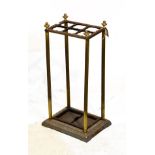 Late Victorian cast metal stickstand of six divisions with wavy borders on rectangular base with