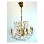 Gilt metal eight branch chandelier with glass lustre swags and drops Condition: