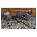 Assorted metalwork to include; a pair of horse hames, two galvanised watering cans, a pricket