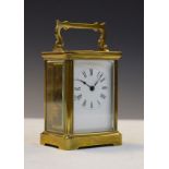 Early 20th Century French brass cased carriage clock, the white enamel dial with Roman numerals,