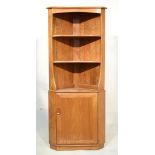 Ercol 'Golden Dawn' elm floor standing corner unit having open section on cupboard base Condition: