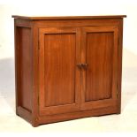 Vintage teak cabinet with rectangular top over twin cupboard doors enclosing shelf, 69cm wide