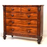 19th Century mahogany chest of drawers, the oblong top with lobed front corners over faceted