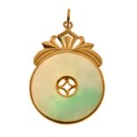 Circular jade mounted pendant in a yellow metal setting, 9.5g approx Condition: