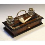 Early 20th Century oak deskstand with twin inkwells flanking carry handle over pen tray and base