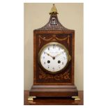 Early 20th Century inlaid and crossbanded mahogany lantern top mantel clock, the white enamel dial
