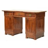 Early 20th Century mahogany twin pedestal desk of inverted breakfront form with brass Secessionist