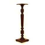 20th Century mahogany torchère or plantstand with square top on turned tapering fluted support and