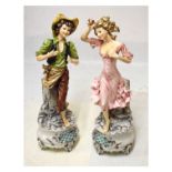 Large pair of 20th Century Italian pottery figures modelled as a boy and girl on bulging circular