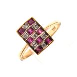 18ct gold dress ring having a rectangular panel set diamonds and ruby coloured stones in a