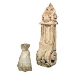 Composition bracket of scroll design, 65cm high, together with a model of a seated dog (2)