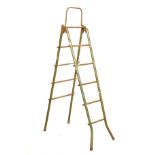 Vintage green-painted tubular metal folding ladder with parallel treads Condition: